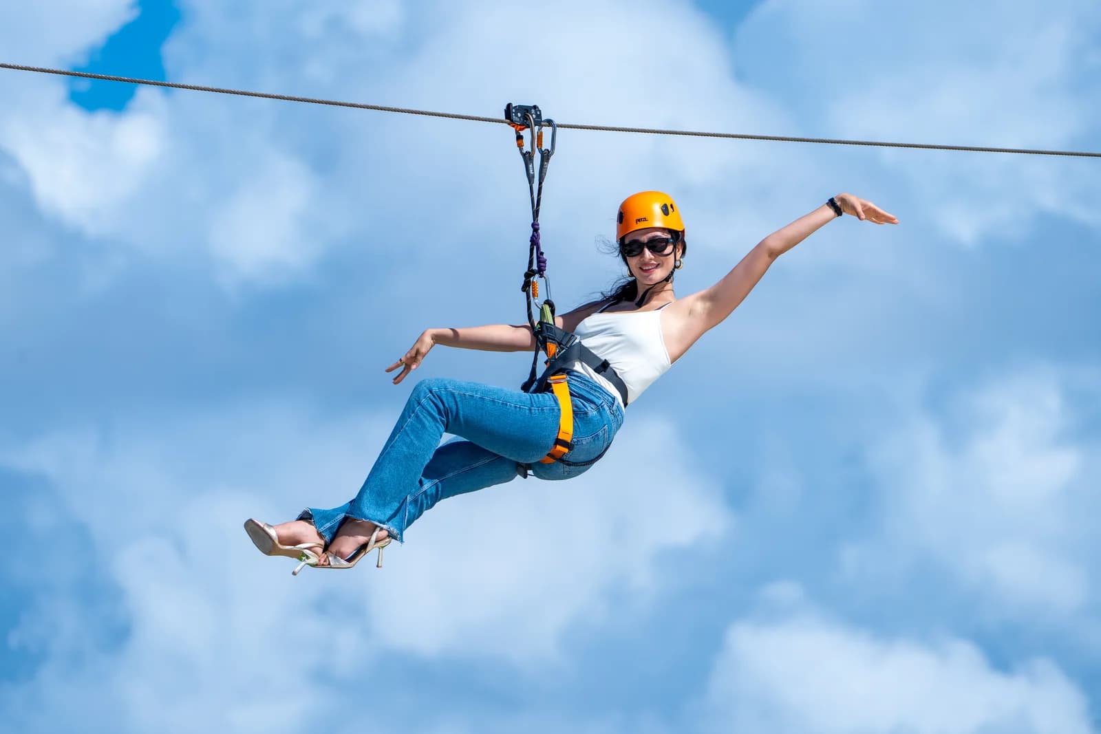 A guest on the island-to-island zipline